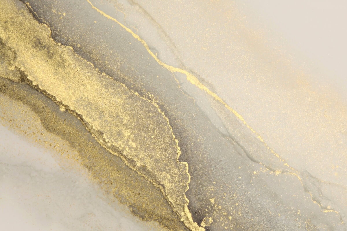 Gold and white marble texture with a touch of gold paint, creating an elegant and luxurious design.