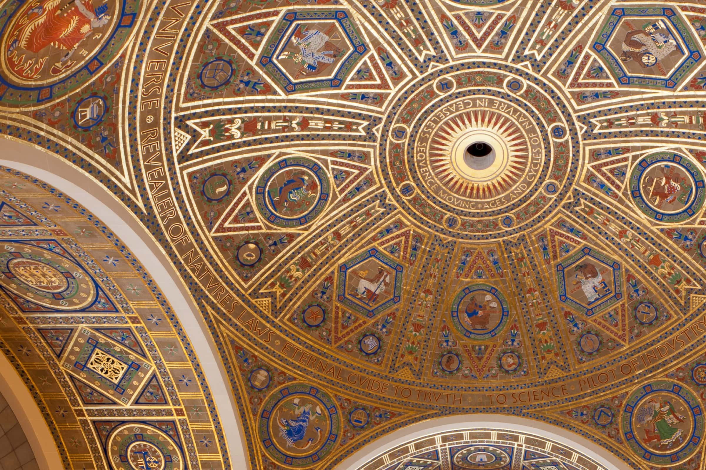 A majestic ceiling with a golden and blue dome, exuding grandeur and elegance.