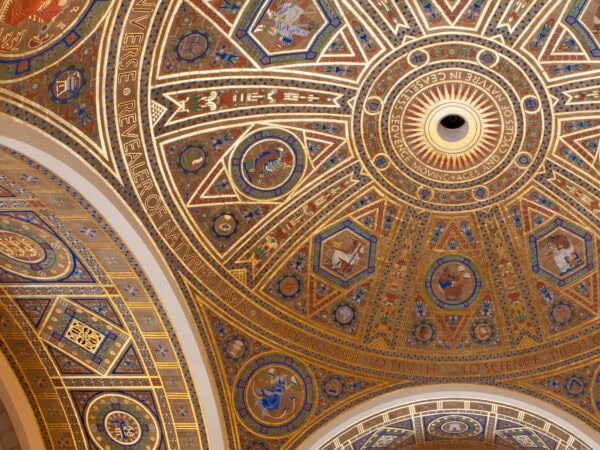 A majestic ceiling with a golden and blue dome, exuding grandeur and elegance.
