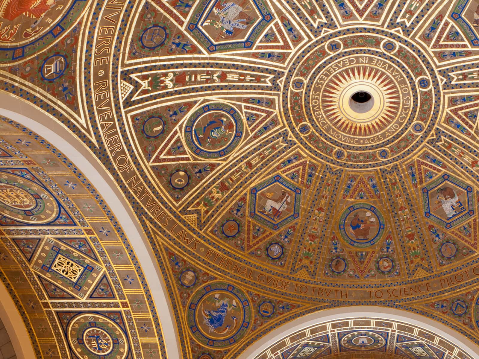 A majestic ceiling with a golden and blue dome, exuding grandeur and elegance.