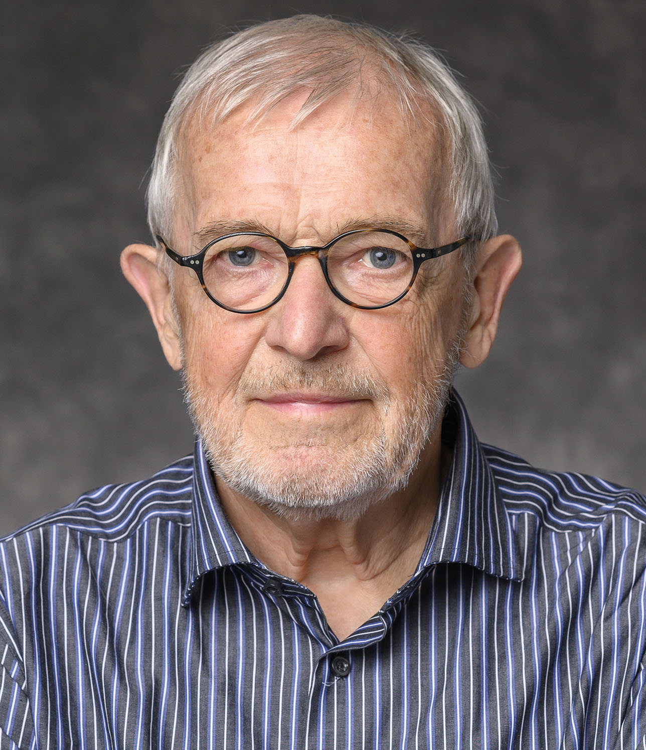 Francis Halzen, principal investigator of IceCube, Vilas Research Professor and Gregory Breit Professor at the University of Wisconsin–Madison, is pictured in a studio portrait on Sept. 18, 2024. (Photo by Althea Dotzour / UW–Madison)